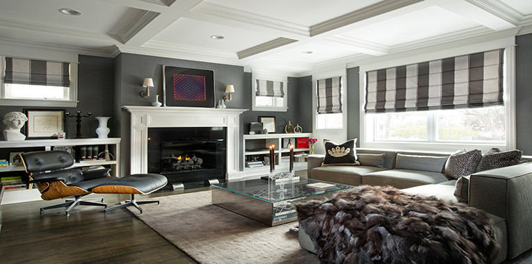 Inspiration for a large traditional enclosed living room in Chicago with grey walls, dark hardwood flooring, a standard fireplace, a wooden fireplace surround, no tv and brown floors.