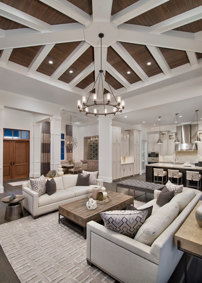 Inspiration for a transitional open concept dark wood floor living room remodel in Miami with white walls