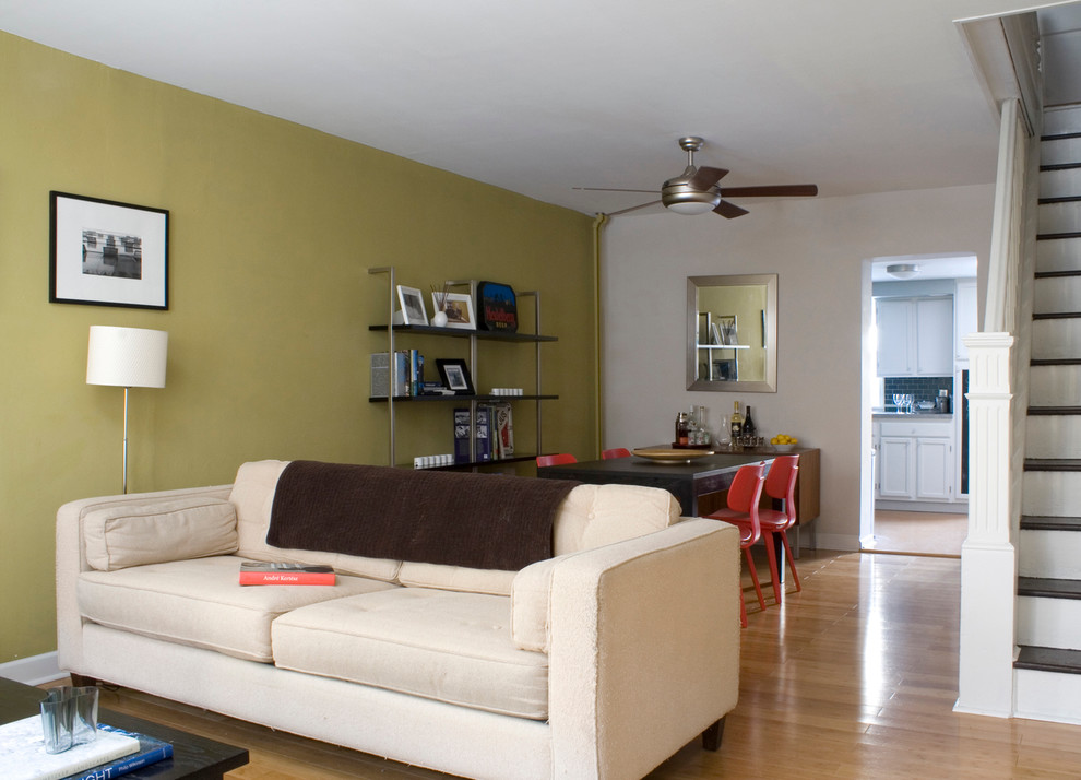 Design ideas for a small modern open plan living room in Philadelphia with light hardwood flooring.