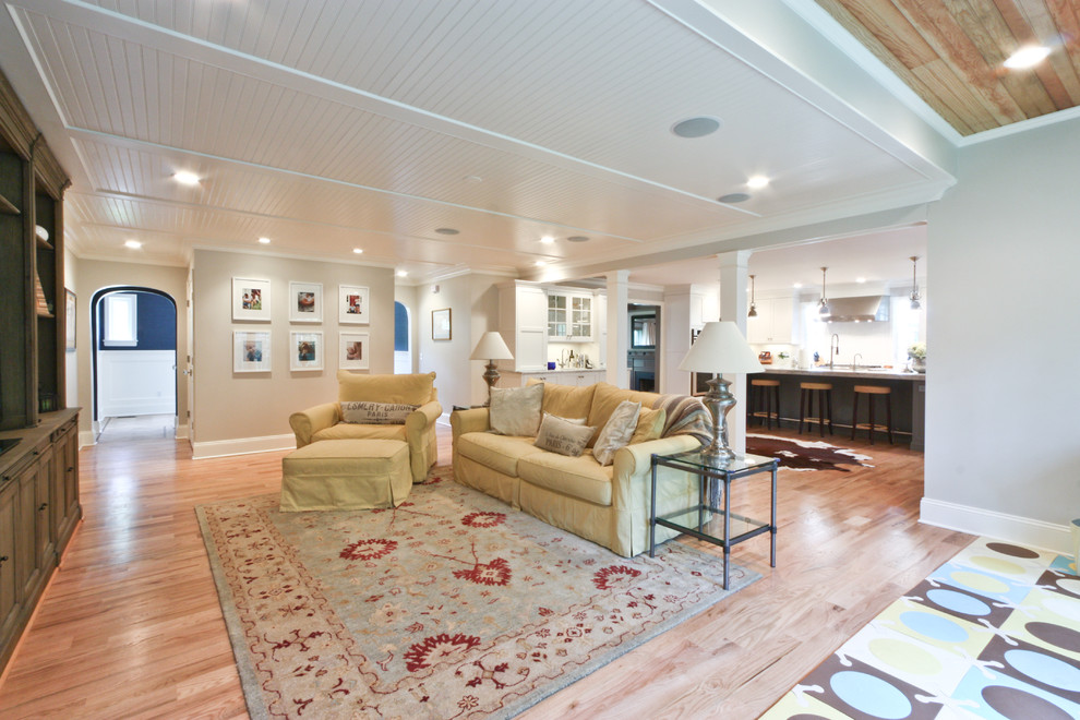Vaulted-Ceiling-beams-big-window-built-in-shelves-California-ranch-chair-Firepla