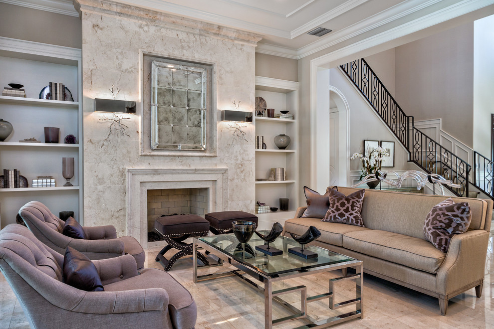 This is an example of a medium sized classic formal open plan living room in Miami with beige walls, a standard fireplace, a stone fireplace surround, no tv and marble flooring.