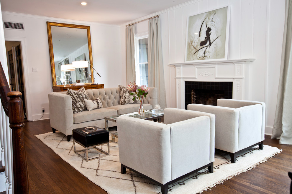 Example of a mid-sized eclectic formal and enclosed dark wood floor living room design in Austin with white walls, a standard fireplace, a wood fireplace surround and no tv