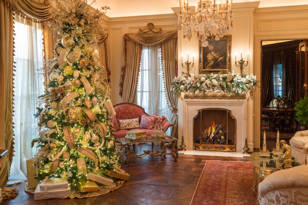 Mid-sized elegant formal and enclosed medium tone wood floor and brown floor living room photo in Dallas with beige walls, a standard fireplace, a stone fireplace and no tv