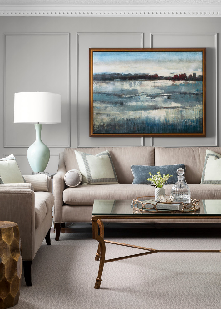 This is an example of a large classic formal and grey and teal enclosed living room in Toronto with grey walls, no fireplace, no tv, medium hardwood flooring, brown floors and feature lighting.