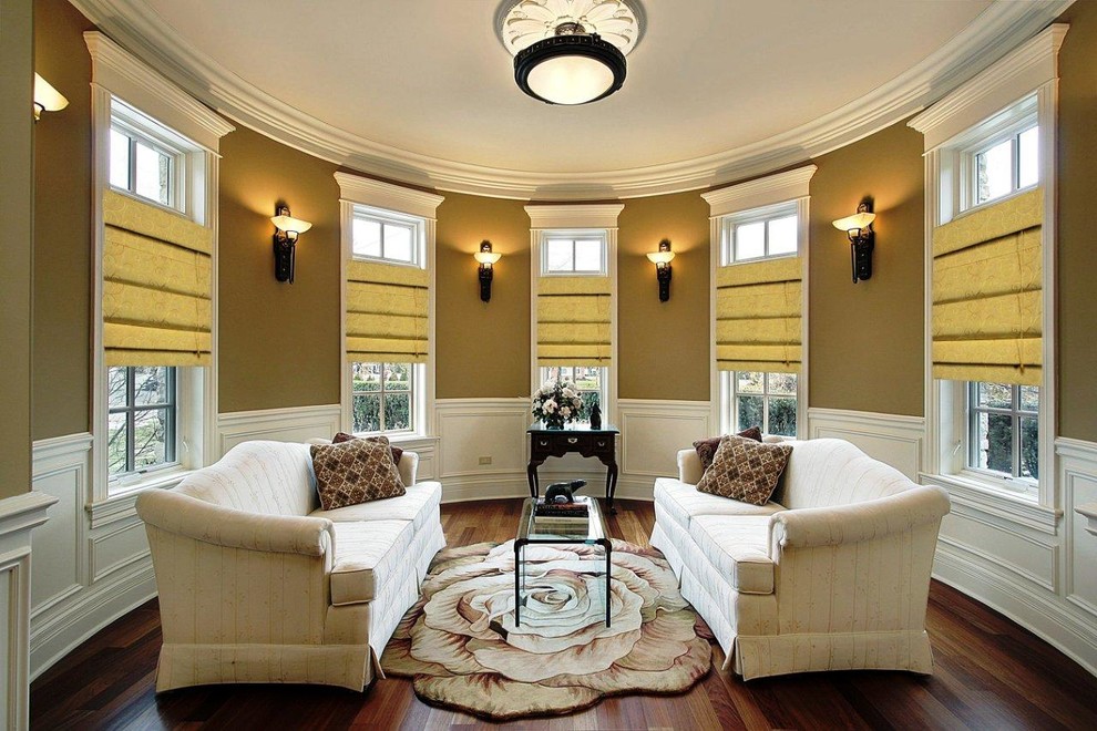 Elegant open concept dark wood floor and brown floor living room photo in Orange County with brown walls