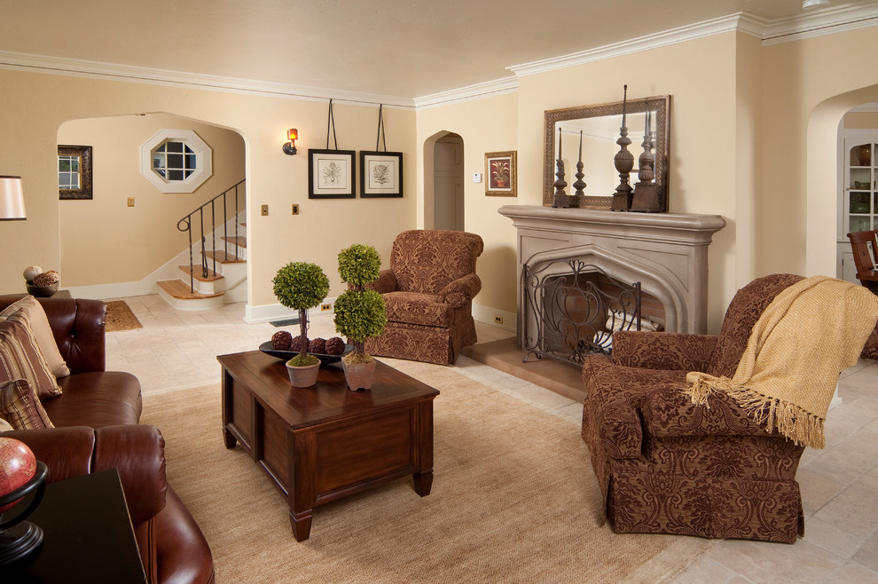 Exemple d'un salon chic avec un mur beige, une cheminée standard, aucun téléviseur et un escalier.