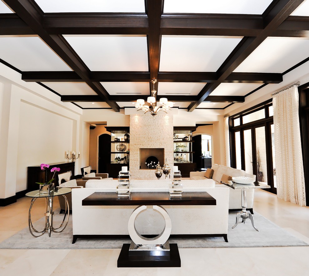 This is an example of an expansive contemporary cream and black living room in Miami with beige walls.