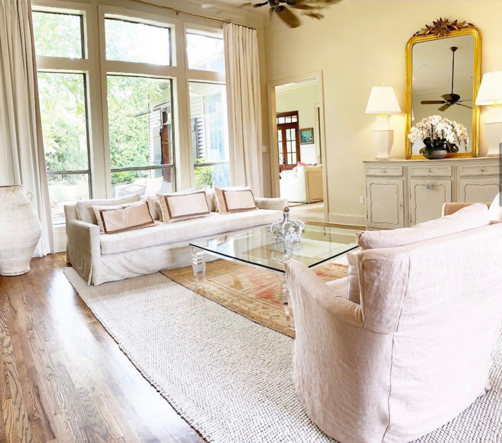 Example of a large french country living room design in New Orleans