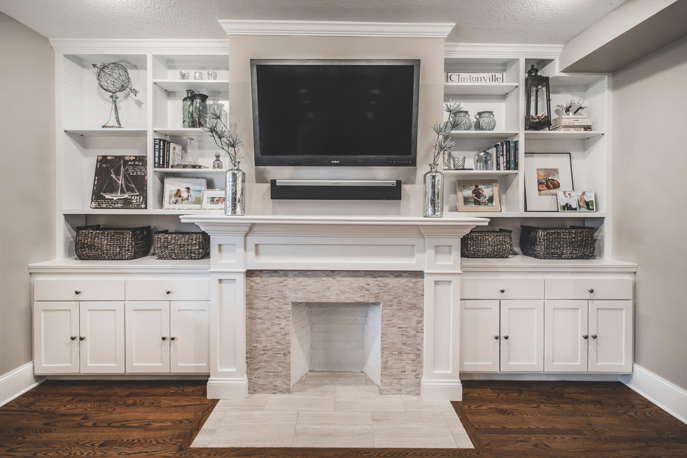 Example of a small transitional enclosed medium tone wood floor living room design in Columbus with gray walls, a standard fireplace, a tile fireplace and a wall-mounted tv
