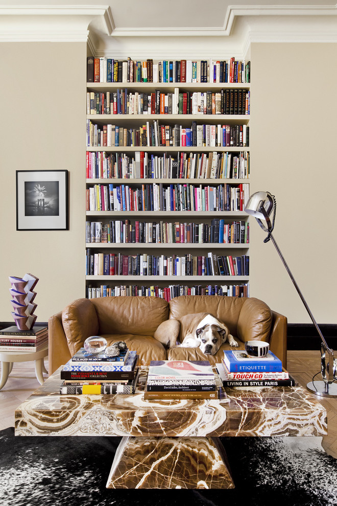 Eclectic living room library photo in New York with gray walls