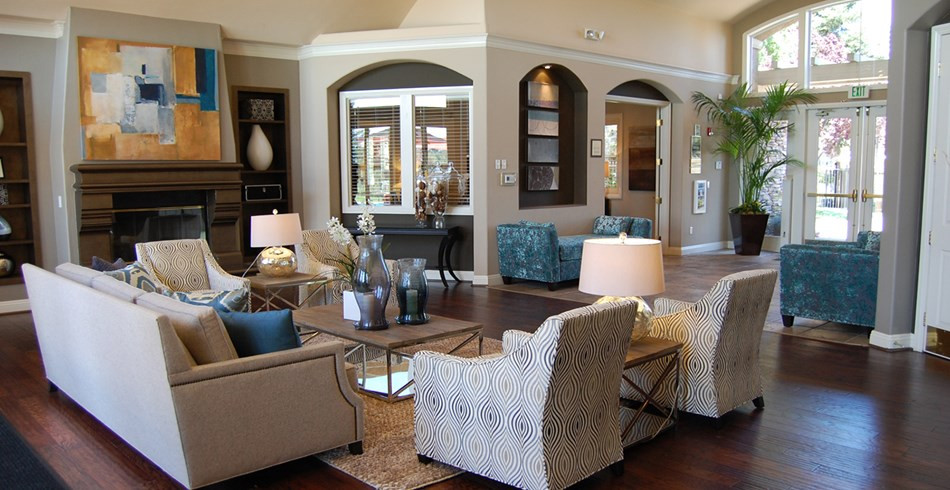Example of a large trendy open concept vinyl floor living room design in Sacramento with beige walls, a standard fireplace and no tv