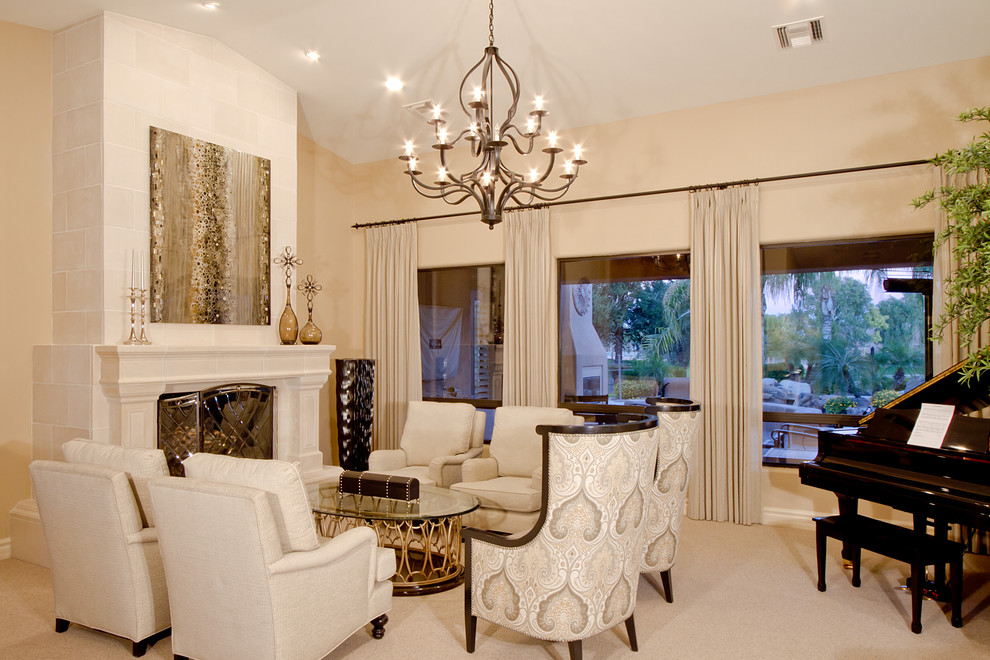 Photo of a large traditional open plan living room in Phoenix with a music area, carpet, a standard fireplace, a concrete fireplace surround and beige walls.