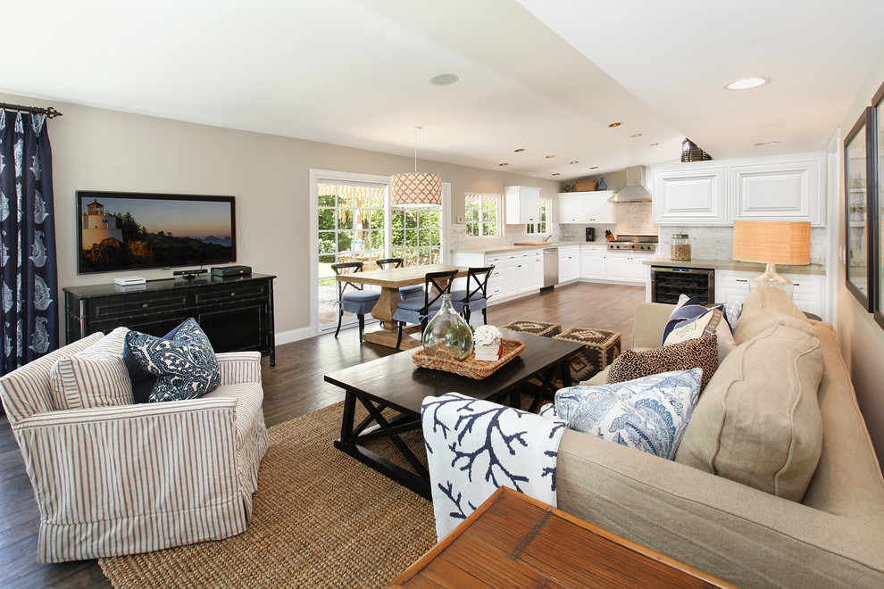 Coastal open plan living room in Orange County with beige walls.