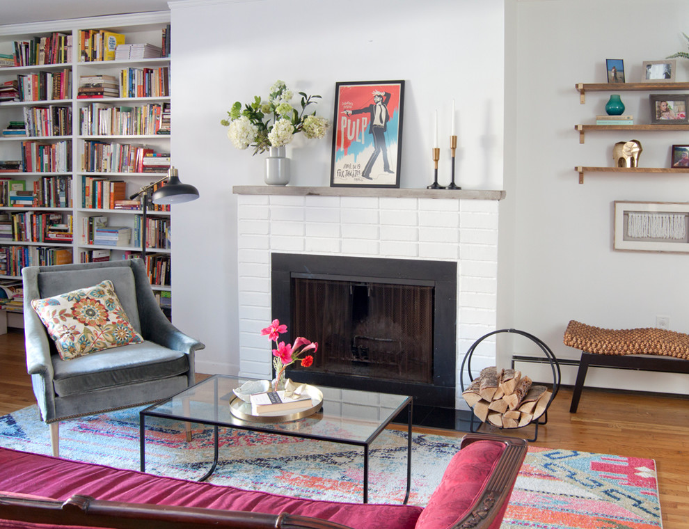 This is an example of a small romantic open plan living room in New York with a standard fireplace and a brick fireplace surround.