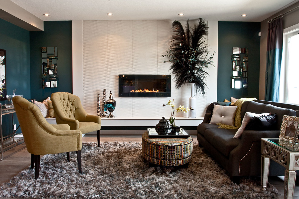 Living room - transitional living room idea in Calgary with blue walls and a ribbon fireplace