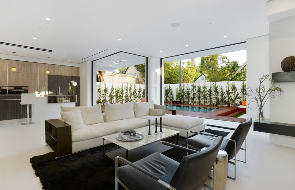 Example of a mid-sized trendy formal and open concept concrete floor and white floor living room design in Los Angeles with white walls, no fireplace and no tv