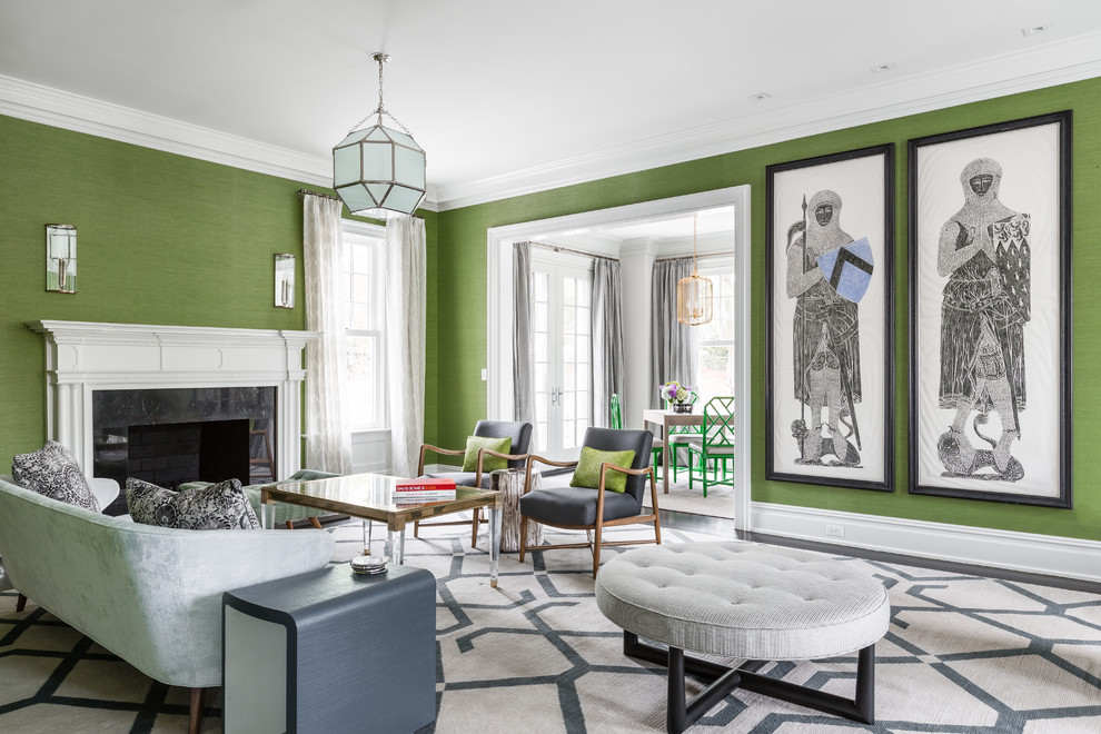 На фото: парадная, серо-белая гостиная комната в стиле неоклассика (современная классика) с зелеными стенами, темным паркетным полом, стандартным камином и фасадом камина из дерева без телевизора