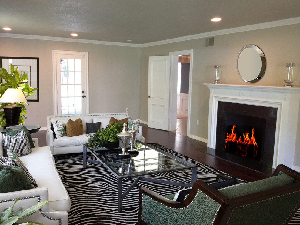 Example of a mid-sized classic enclosed and formal dark wood floor living room design in Oklahoma City with beige walls, a standard fireplace, a wood fireplace surround and no tv