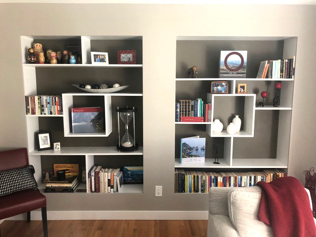 Example of a mid-sized asian open concept medium tone wood floor and brown floor living room design in Other with gray walls, no fireplace and no tv