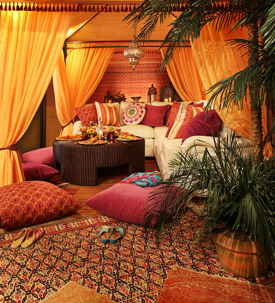 This is an example of a medium sized mediterranean enclosed living room curtain in Detroit with no fireplace, no tv, brown walls, carpet and red floors.