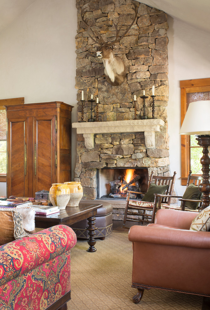 Inspiration for a timeless living room remodel in Denver with a standard fireplace and a stone fireplace