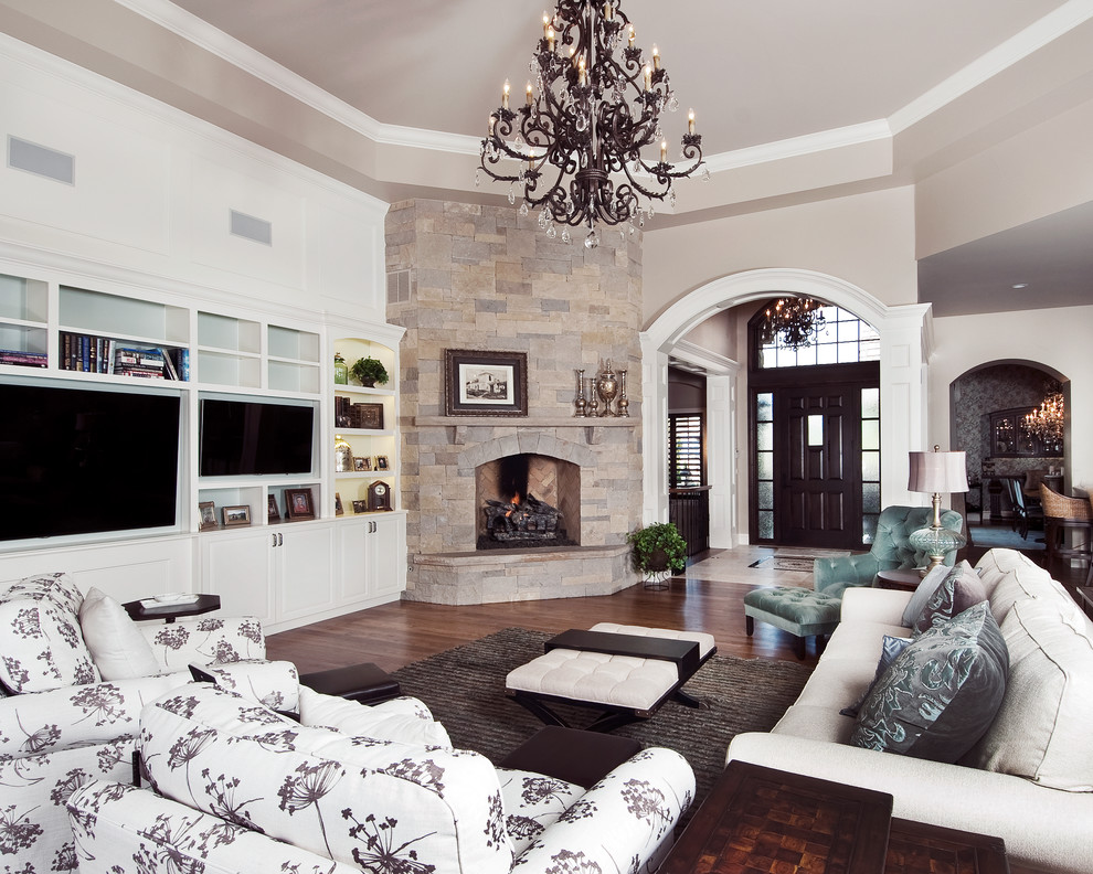 Grey and teal living room in Denver with grey walls, dark hardwood flooring, a standard fireplace, a stone fireplace surround, a built-in media unit and feature lighting.