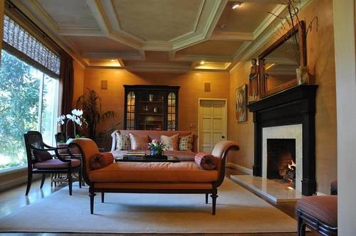 Example of a large classic formal and open concept medium tone wood floor living room design in San Francisco with orange walls, a tile fireplace and no tv