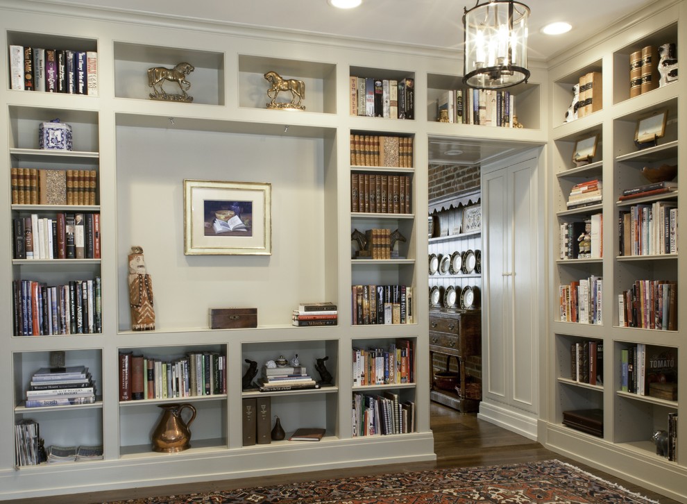 Living room library - cottage enclosed dark wood floor living room library idea in Columbus
