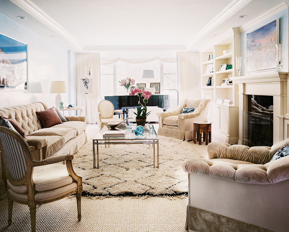 Inspiration for a mid-sized timeless enclosed carpeted living room remodel in New York with blue walls and a standard fireplace