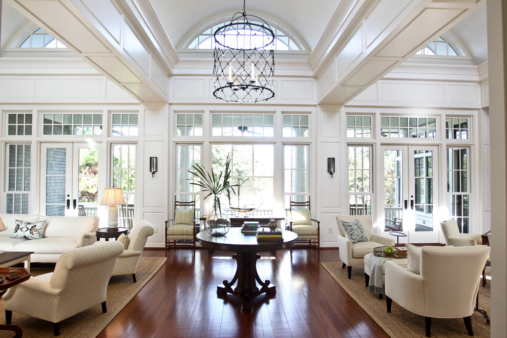 Example of a classic living room design in Charleston with white walls