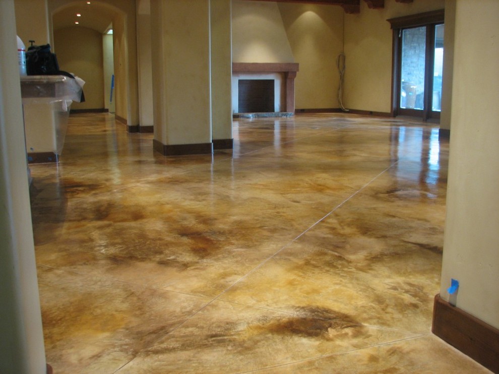 Photo of a large modern living room in Denver with concrete flooring.