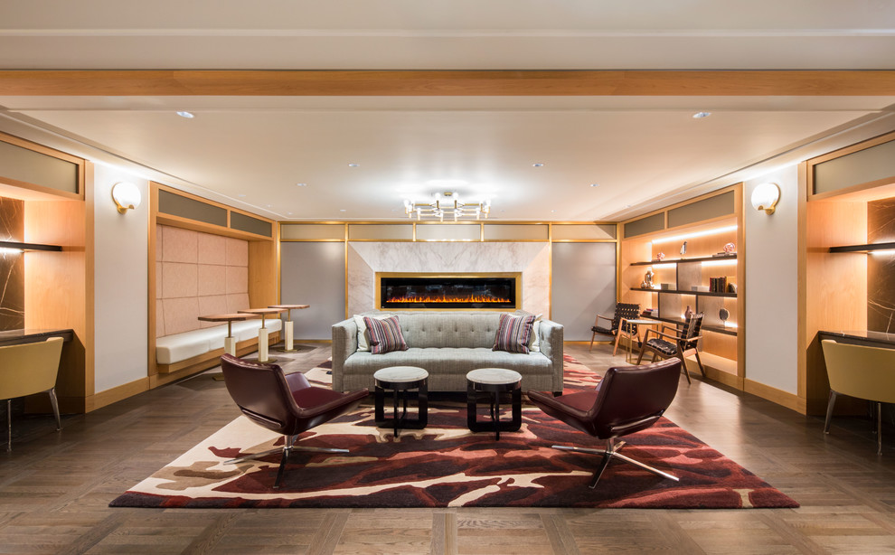 Ispirazione per un soggiorno design con pareti bianche, pavimento in legno massello medio e pavimento grigio