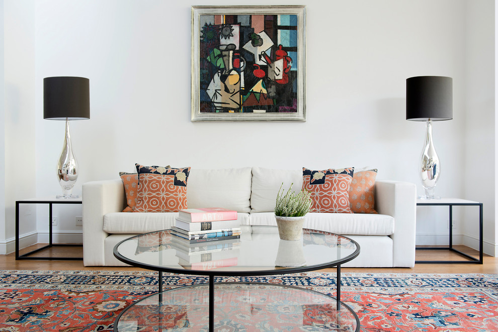 Large transitional open concept light wood floor living room photo in London with white walls