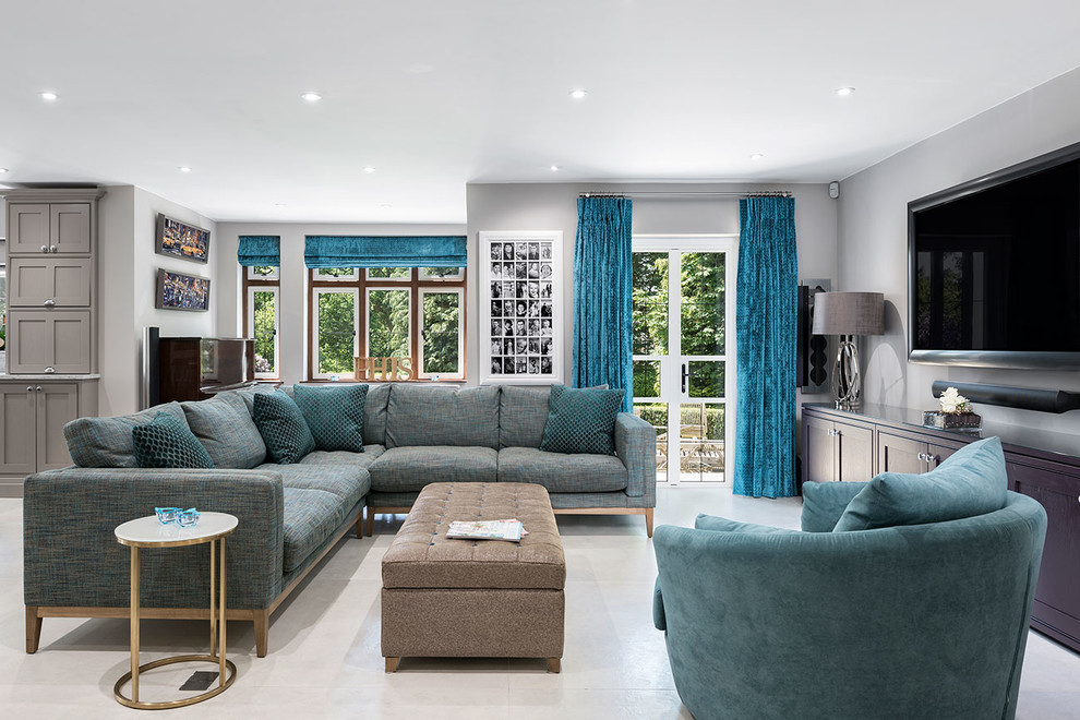 This is an example of a medium sized classic grey and teal open plan living room in Surrey with ceramic flooring, grey floors and grey walls.