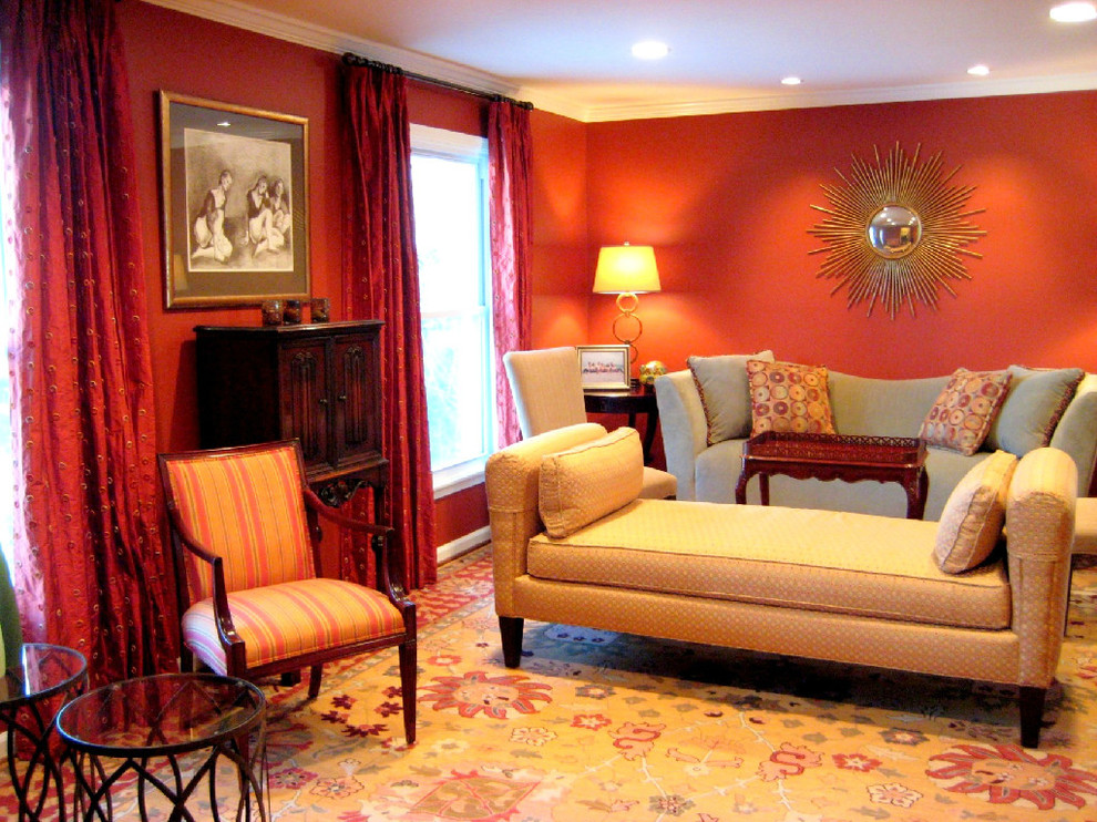 На фото: парадная, изолированная гостиная комната среднего размера в стиле фьюжн с красными стенами, паркетным полом среднего тона и коричневым полом без камина, телевизора