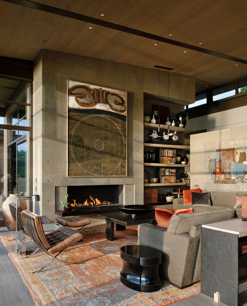 Example of a trendy formal and open concept living room design in Seattle with a ribbon fireplace, a concrete fireplace and gray walls