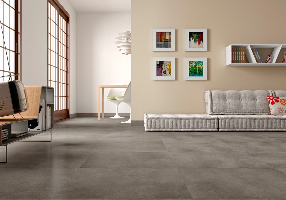 Immagine di un soggiorno minimal con pavimento in gres porcellanato, nessun camino, pareti bianche e TV autoportante