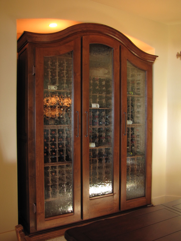 Example of a mid-sized classic carpeted wine cellar design in Austin