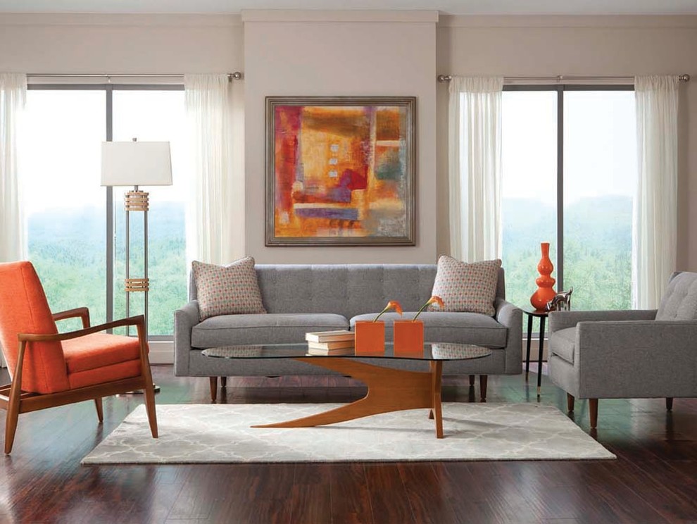 Small modern mezzanine living room in Toronto with beige walls, medium hardwood flooring, no fireplace and a freestanding tv.