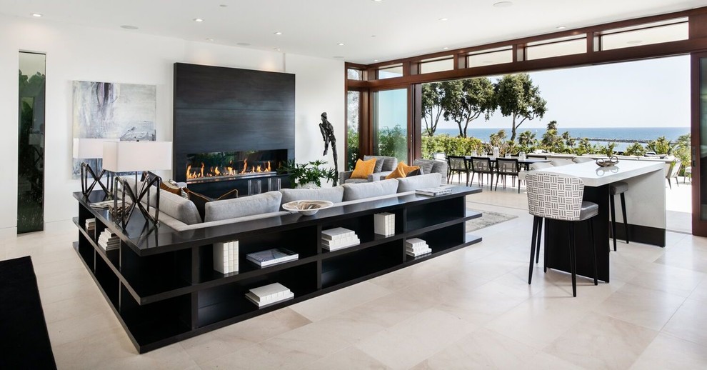 Living room - huge contemporary formal and open concept limestone floor and beige floor living room idea in Orange County with white walls, a ribbon fireplace, a tile fireplace and no tv