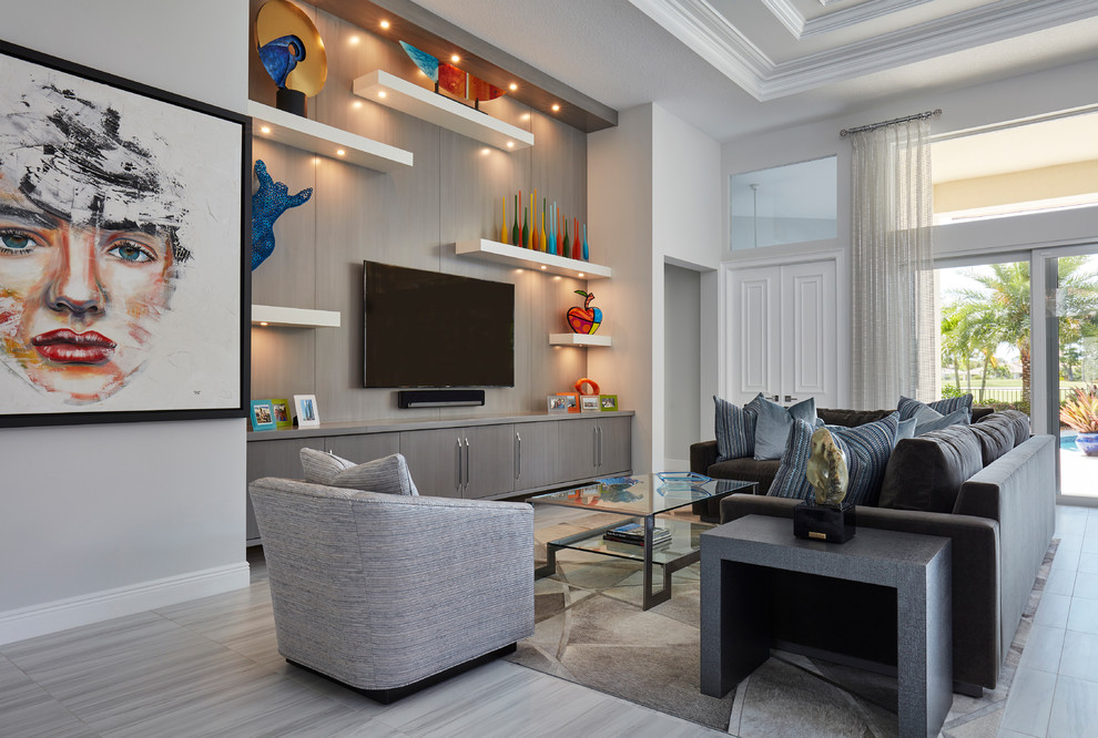 Large contemporary open plan living room in Miami with white walls, painted wood flooring and a freestanding tv.