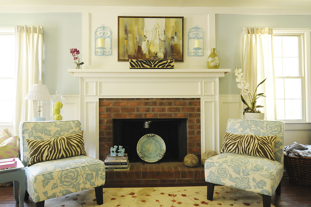 Living room - traditional living room idea in Charleston with blue walls and a brick fireplace