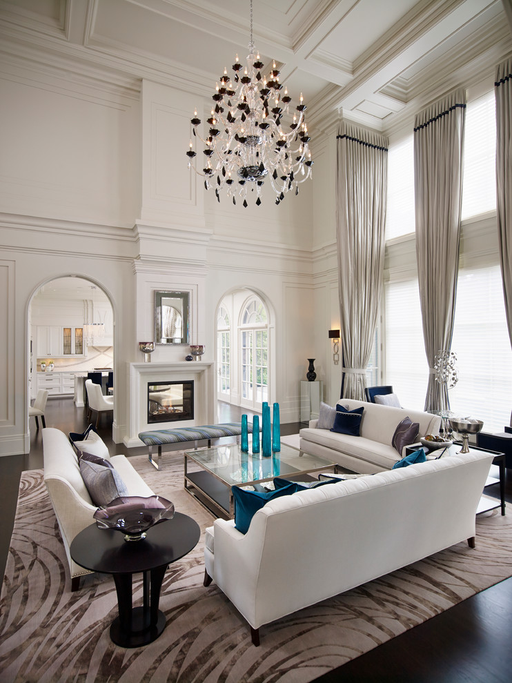 Imagen de salón para visitas abierto clásico renovado grande sin televisor con paredes blancas, suelo de madera oscura y chimenea de doble cara