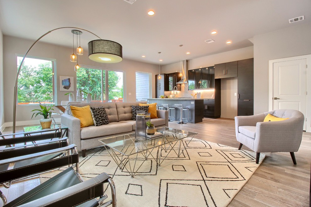 Example of a small trendy formal and enclosed light wood floor and gray floor living room design in Austin with no fireplace, no tv and gray walls