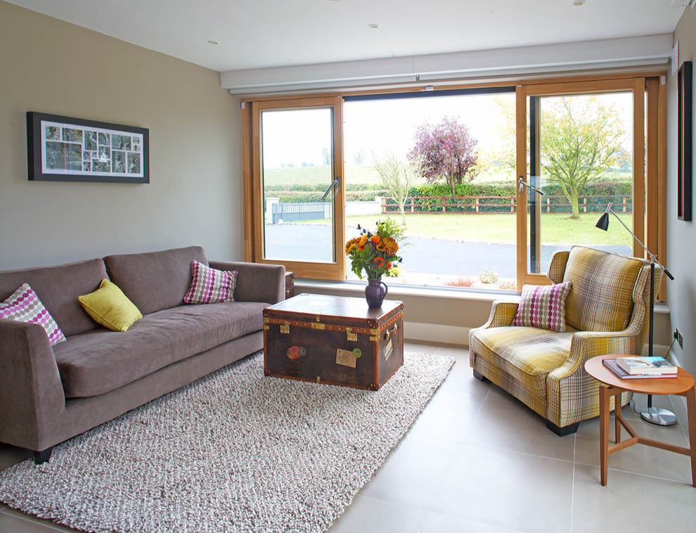 This is an example of a contemporary living room in Dublin with grey walls.