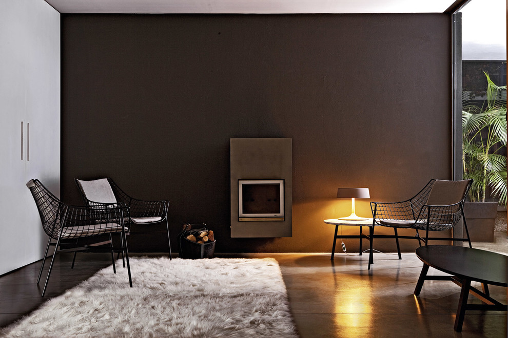 Inspiration for a contemporary formal living room in London with black walls.