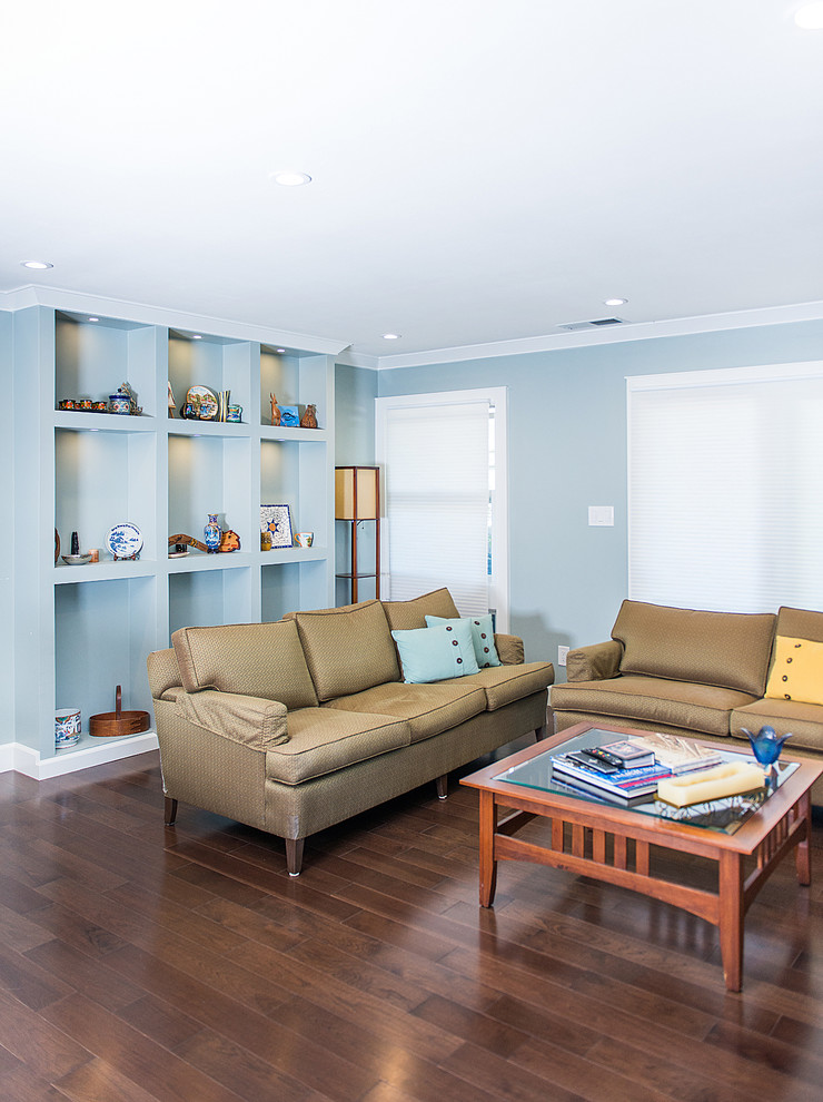 Immagine di un soggiorno design di medie dimensioni con pareti blu e parquet scuro