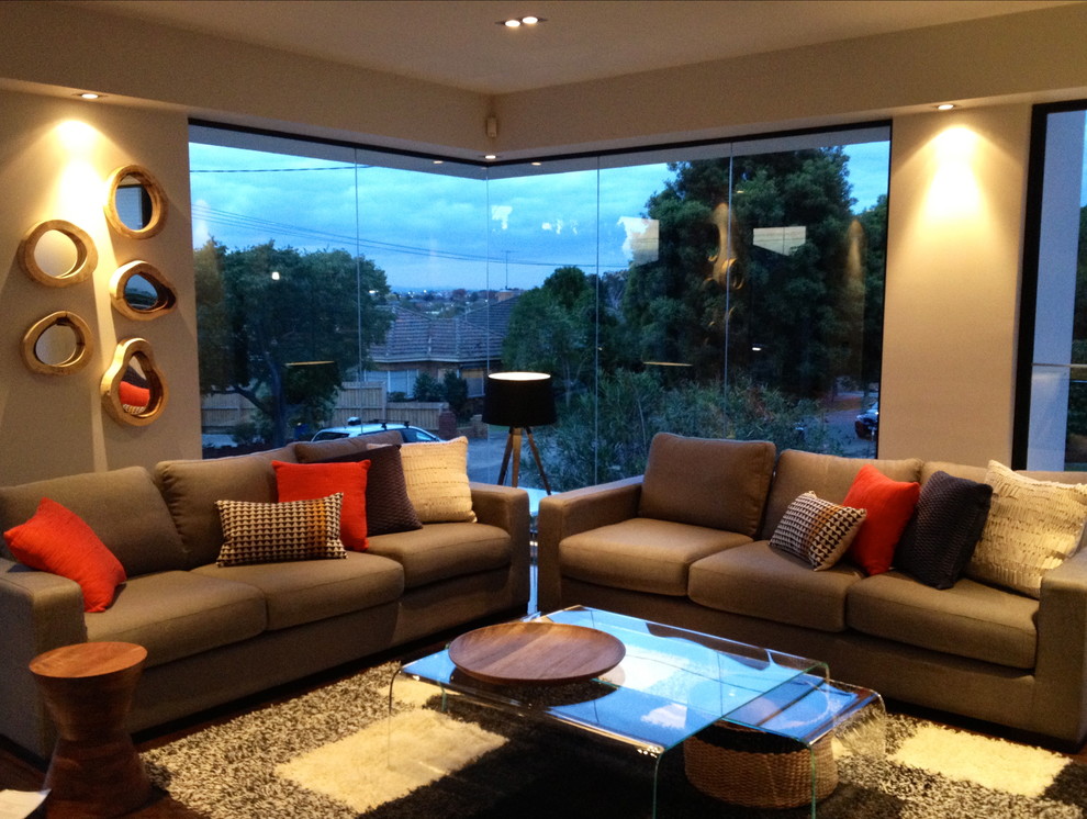 Example of a large trendy open concept living room design in Melbourne
