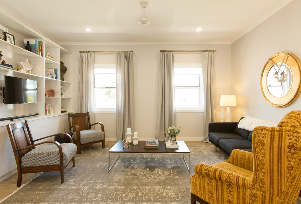 На фото: открытая гостиная комната среднего размера:: освещение в современном стиле с серыми стенами и полом из винила с