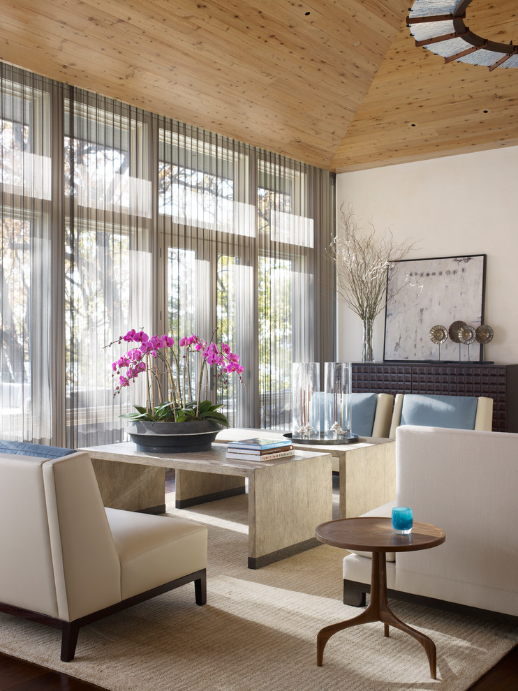 Idee per un soggiorno minimal di medie dimensioni con pareti beige